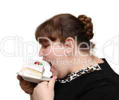 overweight woman biting cake