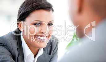 Portrait of a smiling businesswoman talking with her colleague