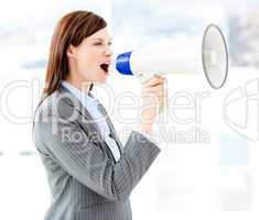 Portrait of an beautiful businesswoman using a megaphone