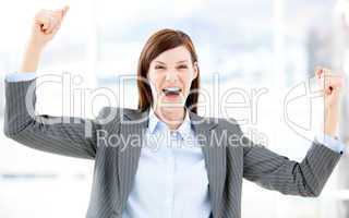 Positive businesswoman punching the air
