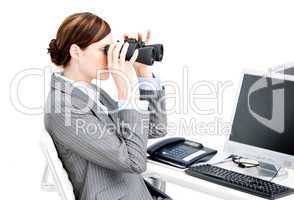 Nice businesswoman using binoculars