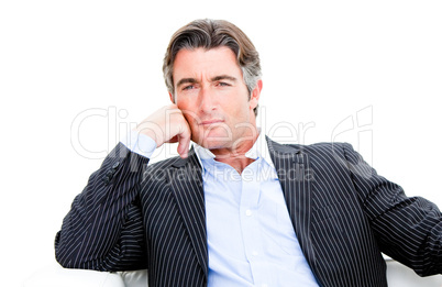 Attractive businessman looking at the camera against white backg