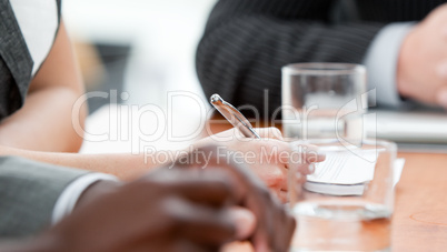 Close-up of a business team listenning a meeting