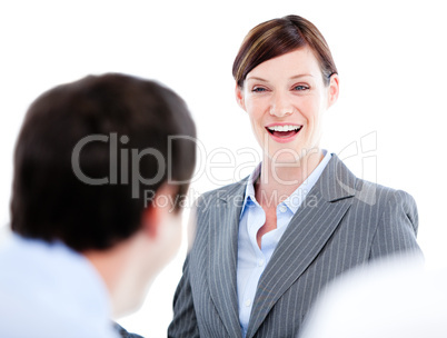 Portrait of a laughing businesswoman talking at her colleague du