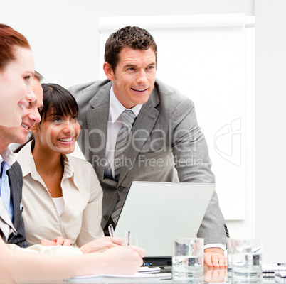 Portrait of anice businesswoman working with her colleagues