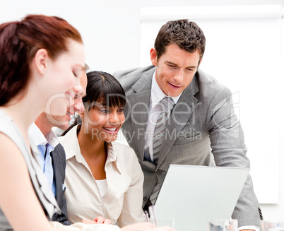 Portrait of a concentrated businesswoman working with her collea