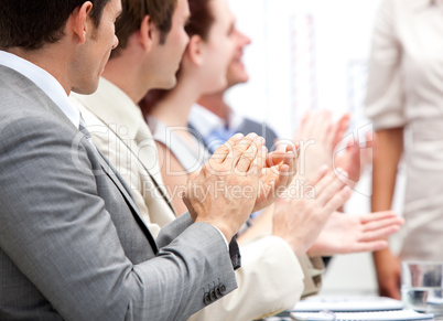Portrait of a businessteam applauding during a meeting