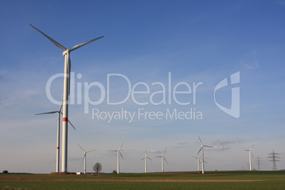 wind turbines under blue sky