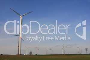 wind turbines under blue sky