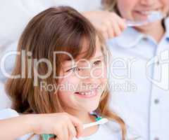 Caucasian child brushing his teeth