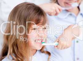 Caucasian girl brushing his teeth
