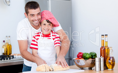 Portrait of a father and his son preparing a meal