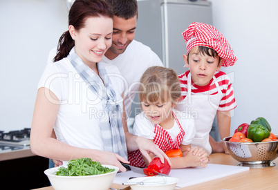 Portrait of a family preparing a meal