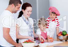 Portrait of a adorable family preparing a meal