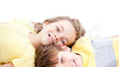 Happy childrens lying on the floor together