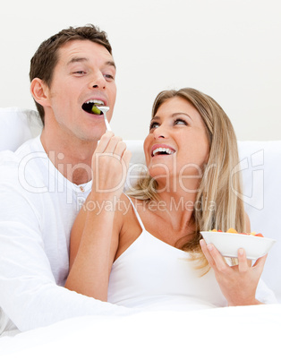 Smiling couple having breakfast