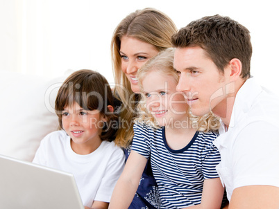 Smiling family surfing on internet