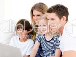 Smiling family surfing on internet