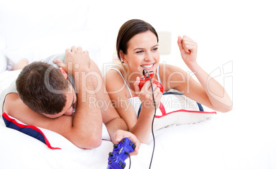 Positive couple playing video games