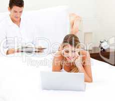 Cute couple surfing on the internet