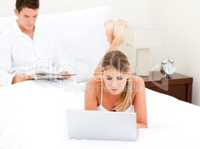 Adorable couple surfing on the internet