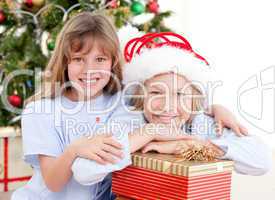 Adorable childrens celebrating christmas