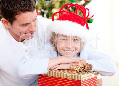Handsome father celebrating christmas with his son