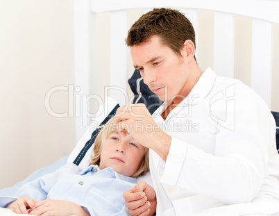 Handsome male doctor examining a child
