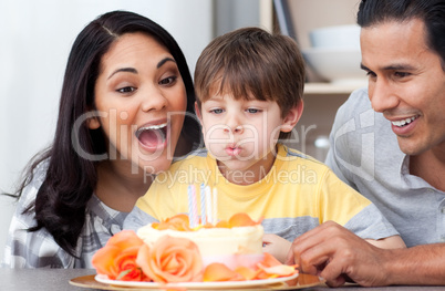 Astonished family celebrating a birthday together