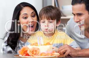 Astonished family celebrating a birthday together