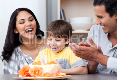 Laughing family celebrating a birthday together