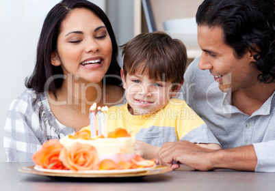 Smiling family celebrating a birthday together