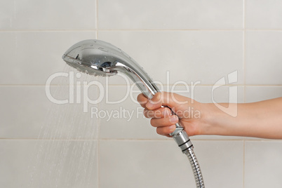 Hand holding the shower