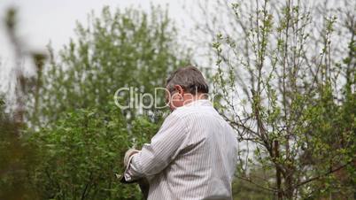 Man cleans lawnmower