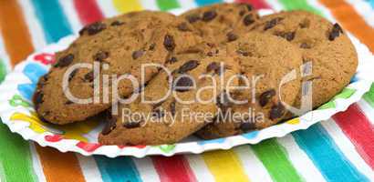 Chocolate chip cookies on colourful background