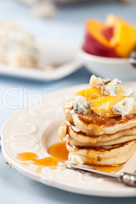 Pancakes with fruit and cheese