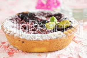 Small cake with prunes and pistachios