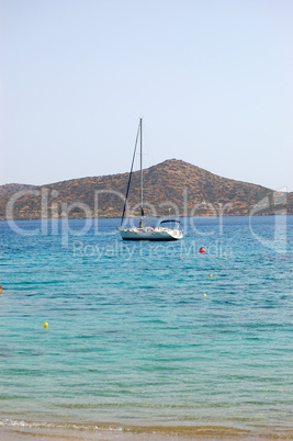 Beach of luxury hotel with yacht view, Crete, Greece