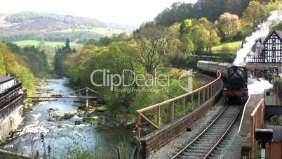 STEAM TRAIN LEAVING STATION