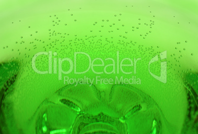 green aerated water in glass