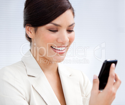 Charming businesswoman using a mobile phone