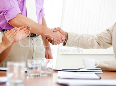 Close-up of two business partners closing a deal