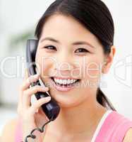 Portrait of a jolly businesswoman talking on phone