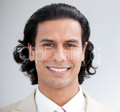 Confident businessman smiling at the camera