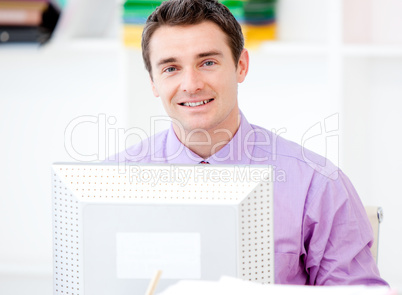 Serious businessman working at a computer