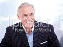 Portrait of a cheerful senior businessman smiling