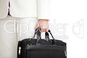 Close-up of a businesswoman holding a briefcase