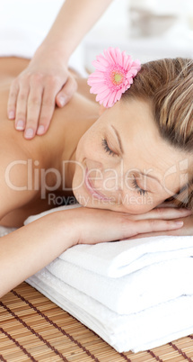 Relaxed woman having a flower