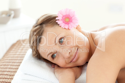 Portrait of a sexy woman having a flower