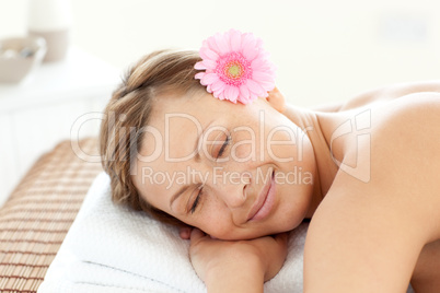 Portrait of an attractive woman having a flower